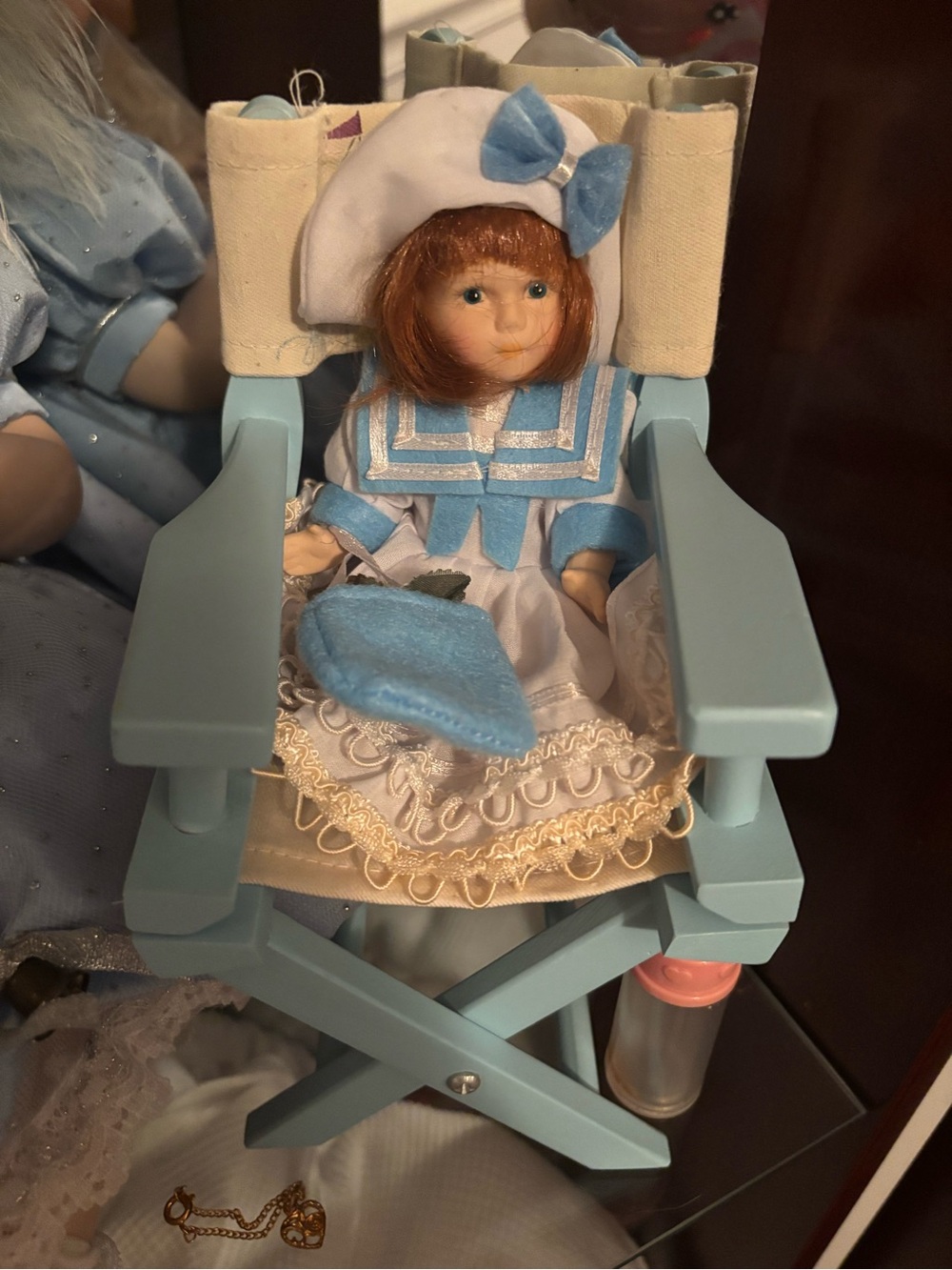 Blue and White Porcelain-Style Doll in Blue Wooden Chair - Brand Unknown